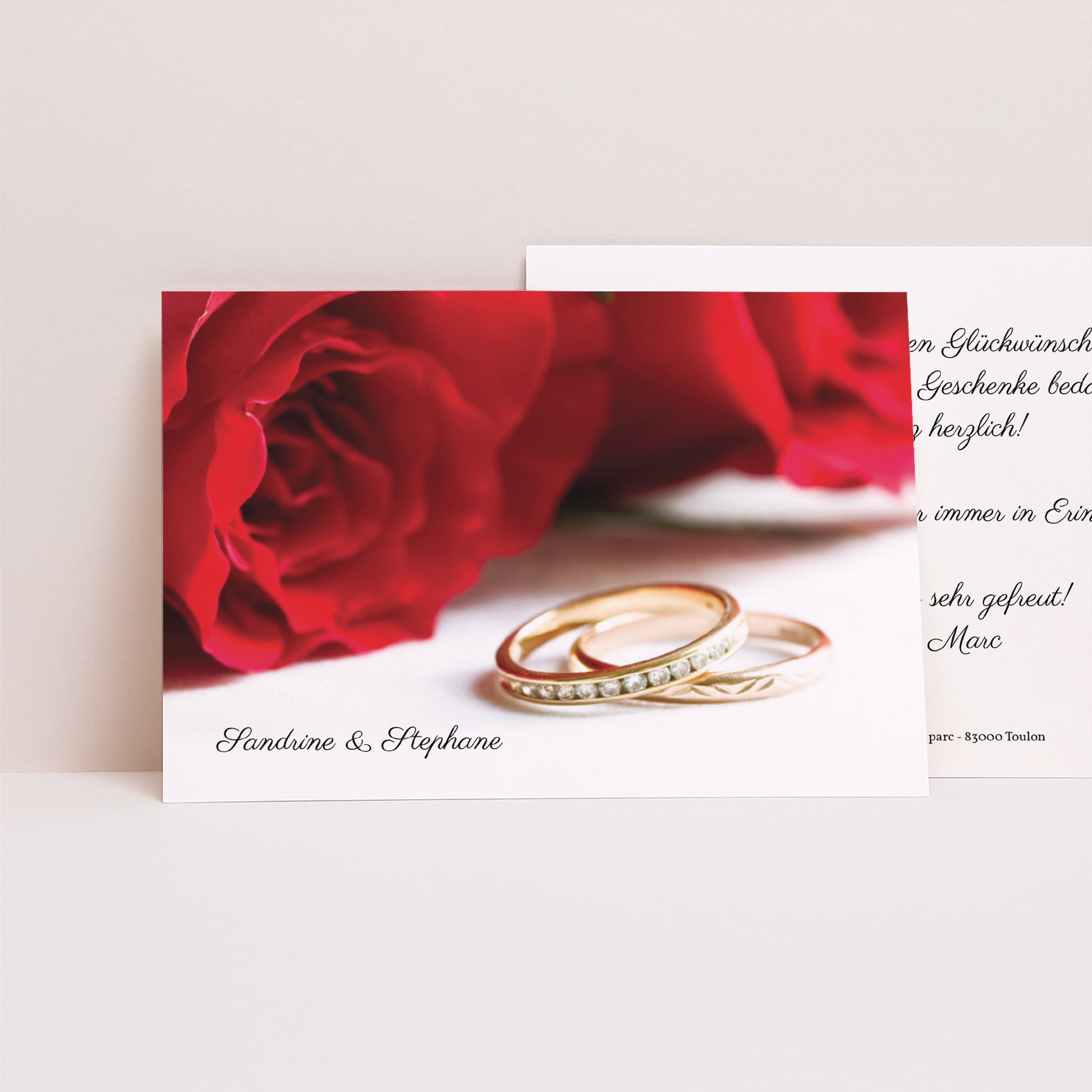 Dankeskarte Hochzeit Landschaft Rote Rosen und Eheringe foto N° 1