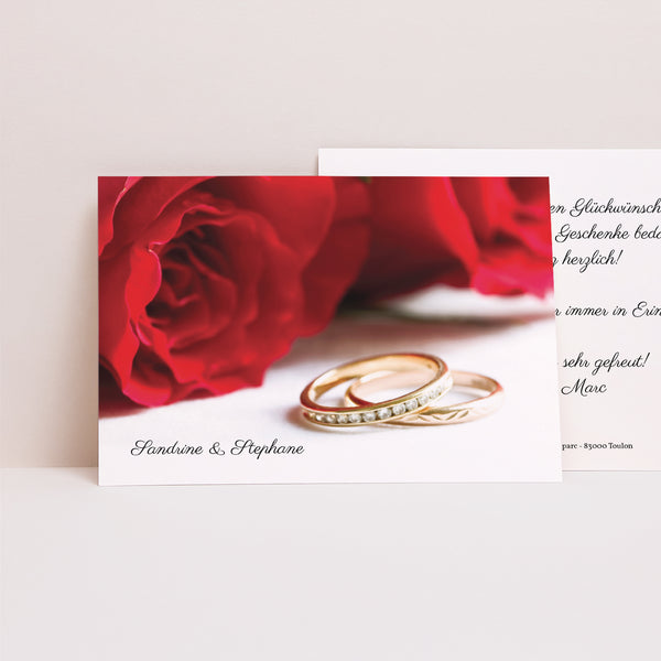 Dankeskarte Hochzeit Landschaft Rote Rosen und Eheringe foto